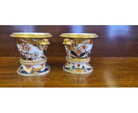 Pair of Spode 967 Imari pattern small jardinieres on stands.