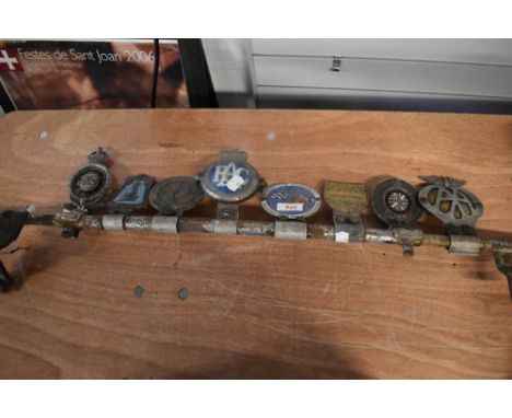 A collection of vintage Motoring badges, including club badges, AA, RAC and more.
