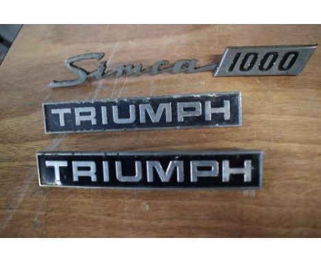 Three vintage car bonnet/ boot name badges, of Triumph and Simca interest.