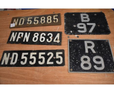 A collection of vintage number plates.