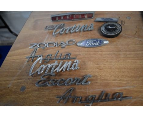 A collection of vintage car bonnet/ boot name badges etc, of Ford interest, including Cortina and Escort.