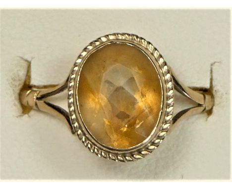 A 9ct gold and citrine single stone ring, K, 2.1gm 