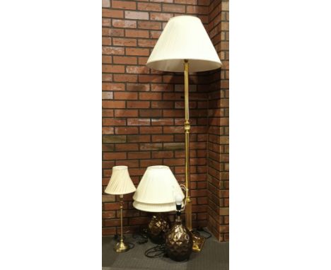 A modern brass standard lamp (with shade) together with a pair of table lamps with shades and a brass column table lamp &amp;