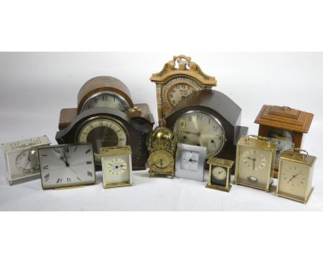 Two boxes of mid 20th Century clocks, to include a Smiths manual wind brass lantern clock, a Swiza alarm clock, a mahogany ca