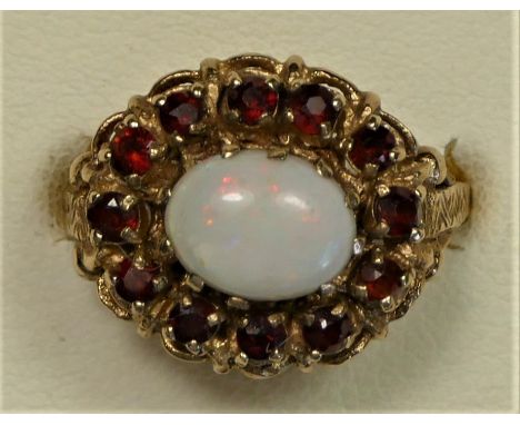 A 9ct gold opal and garnet cluster ring, ornate mount, N 1/2, 4.7gm 