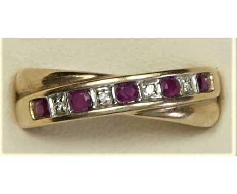 A 9ct gold ruby and diamond crossover band ring, M, 2.9gm 