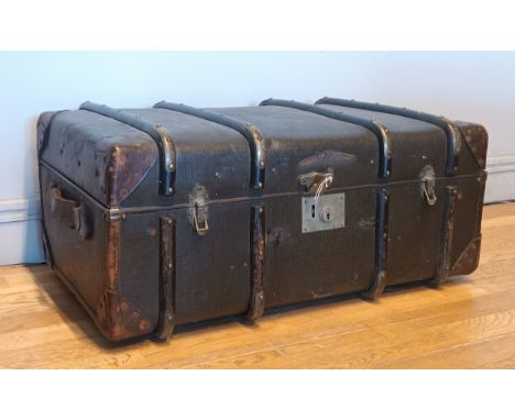 An early 20th Century beech bound & leather traveling trunk, with lined interior and fitted divider.W75cm, D38cm. 