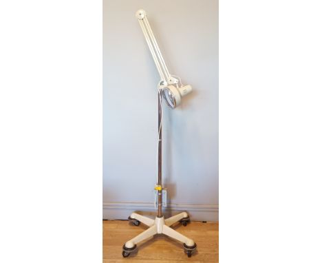 A mid 20th Century floor standing anglepoise surgical lamp, made by Thousand And One Lamps Ltd, of Bromley Rd London. 