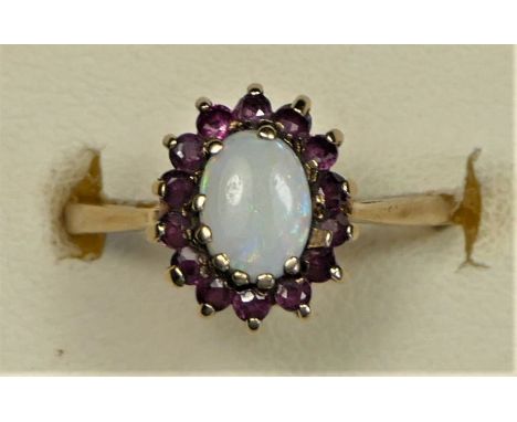 A 9ct gold opal and ruby cluster ring, J, 1.7gm 