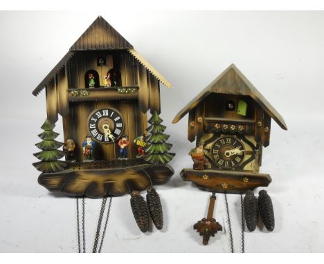 A 1970's German Black Forest cuckoo clock, having carousel and articulated dancing figures, 1 day movement (missing pendulum)