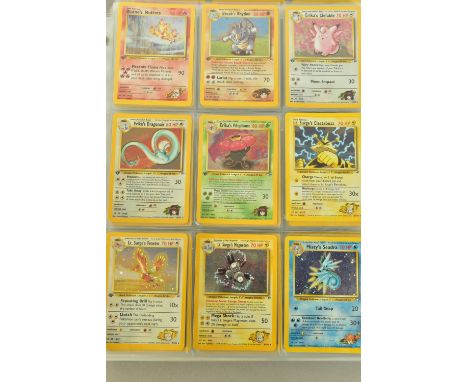 THE COMPLETE POKEMON CARDS GYM HEROES SET, containing mostly first edition cards. First editions include Blaine’s Moltres 1/1