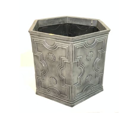 AN HEXAGONAL FAUX LEAD PLANTER60cm wide; 54cm high