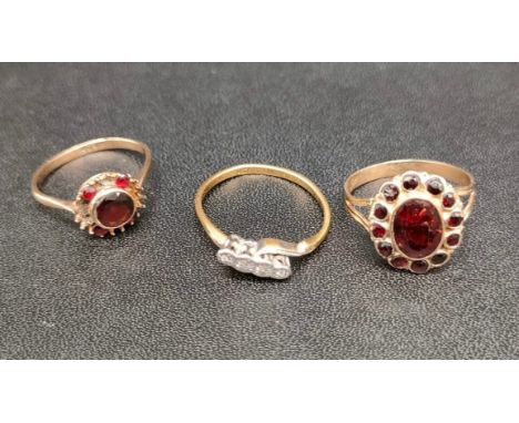 Three various gold rings; 18ct gold and platinum diamond ring- band damaged- [2.44grams] and two antique 9ct gold and garnet 