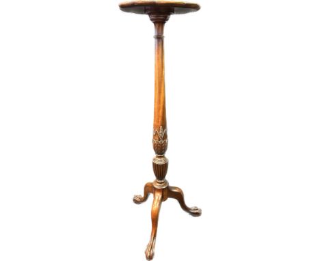 19th Century plant stand, the surface with scalloped edging raised on a tapered carved column and tripod base ending claw and