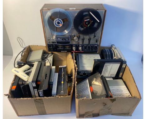 Akai 4000DB reel to reel recorder player with a vintage reel tapes with big names such as the police, John Lennon &amp; many 