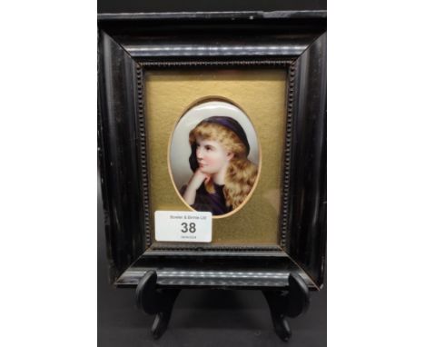 19th century hand painted portrait on porcelain of a cloaked girl. Fitted within a small dark frame [16.5x14cm] 