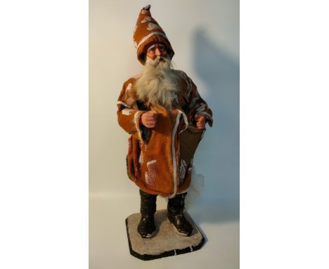 Antique sculpture model of father Christmas supported on a wooden plinth 