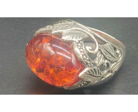 Silver Ring set with a large amber stone 