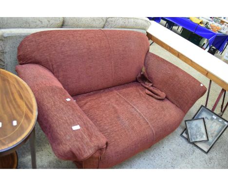 RED TWO-SEATER SOFA RAISED ON TURNED LEGS