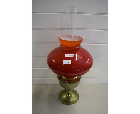 20TH CENTURY OIL LAMP WITH RED GLASS SHADE