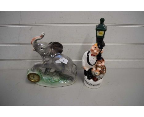ITALIAN LUSTRE FINISHED MANTEL CLOCK WITH ELEPHANT MOUNT TOGETHER WITH A FURTHER MUSICAL NOVELTY DECANTER MARKED 'ALL LIT UP'