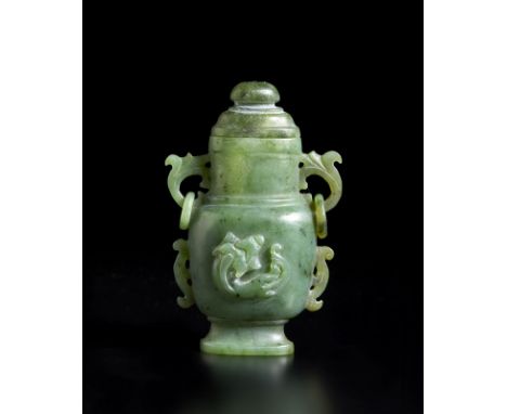 A small green jade vase and cover carved with qilong in relief China, Qing dynasty, 19th century   Cm 6,00 x 9,00 x 3,50