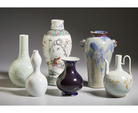 A group of six porcelain vases China, Qing dynasty, 19th century  IncludingA claire de lune glazed teapot (h. 18,5 cm); A cel
