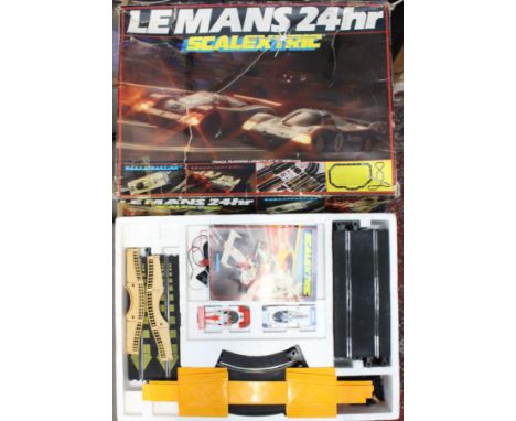 Scalextric: A boxed Scalextric Le Mans 24hr set, comprising two vehicles, track and trackside accessories, some damage to box