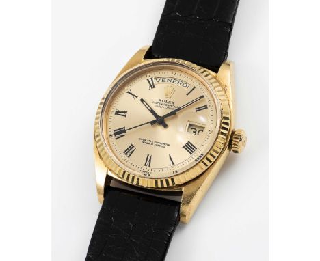 A GENTLEMAN'S 18K SOLID YELLOW GOLD ROLEX OYSTER PERPETUAL DAY DATE WRIST WATCHCIRCA 1973, REF. 1803 WITH CHAMPAGNE "BUCKLEY"