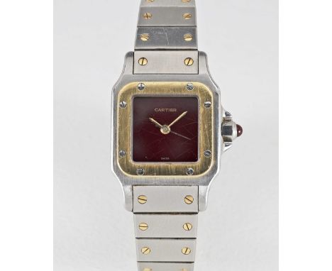 A LADIES STEEL & GOLD CARTIER SANTOS AUTOMATIC BRACELET WATCHCIRCA 1990, WITH BURGUNDY DIALMovement: Automatic, signed Cartie