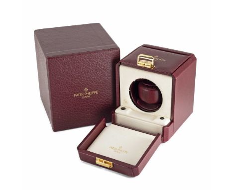A BURGUNDY LEATHER COVERED PATEK PHILIPPE WATCH WINDER IN ITS ORIGINAL OUTER BOXCIRCA 1990The winder measures approx 11.5cm /