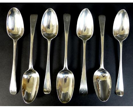 A collection of seven George III silver tablespoons, comprising two with transitional rat tail backs, monogram engraved, Thom