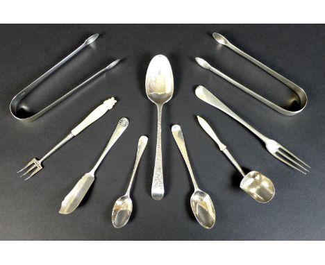 A group of Georgian and later silver pieces of flatware, comprising a George II silver three tined fork, Paul Hanet, London c