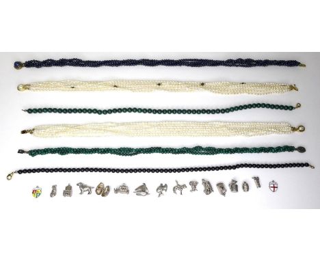 A group of six beaded necklaces, comprising two freshwater pearl seven stranded chokers, one with garnets interspersed, both 