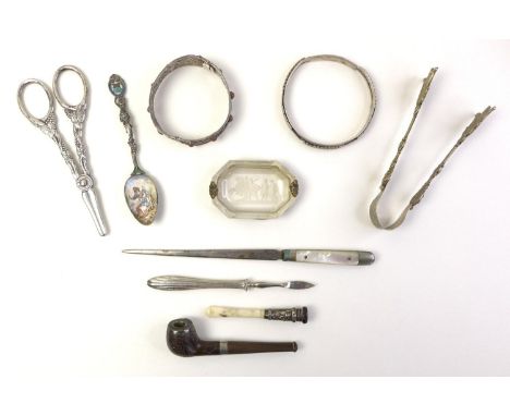 A group of collectables, comprising a silver and enamelled spoon with engraved decoration, 11.5cm, a small pipe with silver w