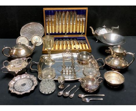 Plated Ware - a three piece tea service;  a two handled tray;  toast racks;  comport;  twelve fish knives and forks, cased;  