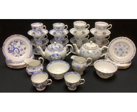 A Royal Tuscan Love in the Mist tea service, for six, comprising cups, saucers, side plates, teapot and cover, milk and sugar