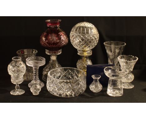 A cut glass Golden Age Collection electric table lamp, ruby flashed; another clear cut glass table lamp; a Stuart cut glass v