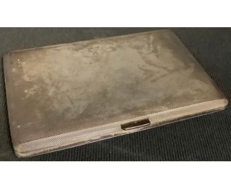 An Elizabeth II silver rounded rectangular cigarette case, engine turned, gilded interior, Birmingham 1959, 183g 