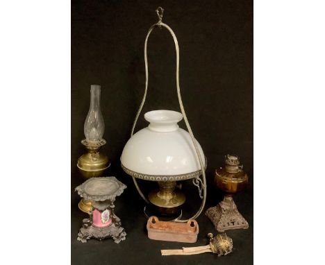 Lighting - a 20th century ceiling oil lamp, Famos brass reservoir, milk glass shade, pierced holder, the shaped frame engrave