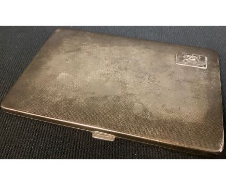 A George V silver rounded rectangular cigarette case, engine turned, monogrammed, Birmingham 1932, 183g 