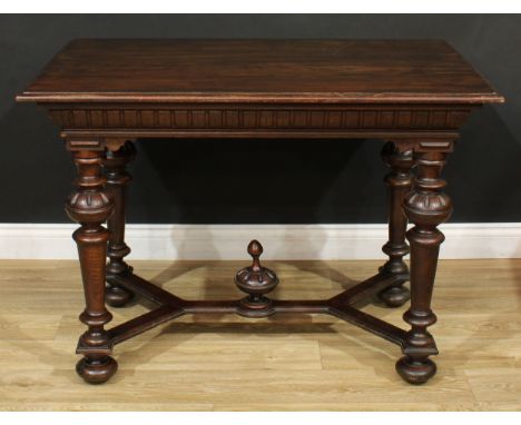 A Spanish Baroque style oak serving table, rectangular top with moulded edge, turned supports, forked stretcher centred by an