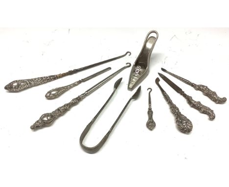 Silver hafted button hooks [3]; silver hafted manicure tools [4]; etc (9) 