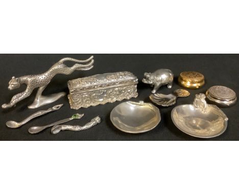A late Victorian silver embossed trinket box, hinged cover, Birmingham 1900, 9.5cm wide; a pewter leopard, 13cm wide; a pewte