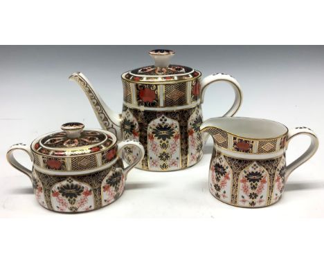 A Royal Crown Derby Imari 1128 pattern bachelor's teapot, milk jug, sucrier and cover, 15cm high, printed marks, first qualit