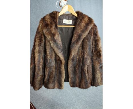 A vintage brown mink fur coat with brown silk lining by Scottish furriers Alexander Wilkie. Label to the interior. 