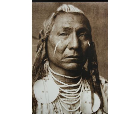 A large modern decorative print of a Native American. Framed and glazed. H.90 W.73 cm. 