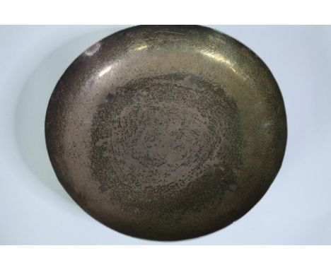 An Egyptian silver bowl with engraved stylised foliate design. Four button feet to the base. Mark to base. Dia.22cm. Weight 4