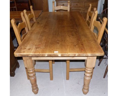 A pine refectory dining table and 6 ladder back dining chairs