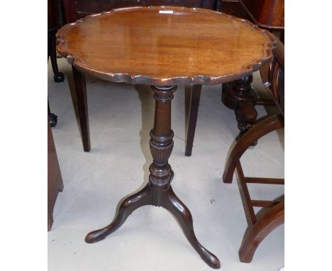 A Georgian style mahogany scalloped snap top occasional table on tripod base